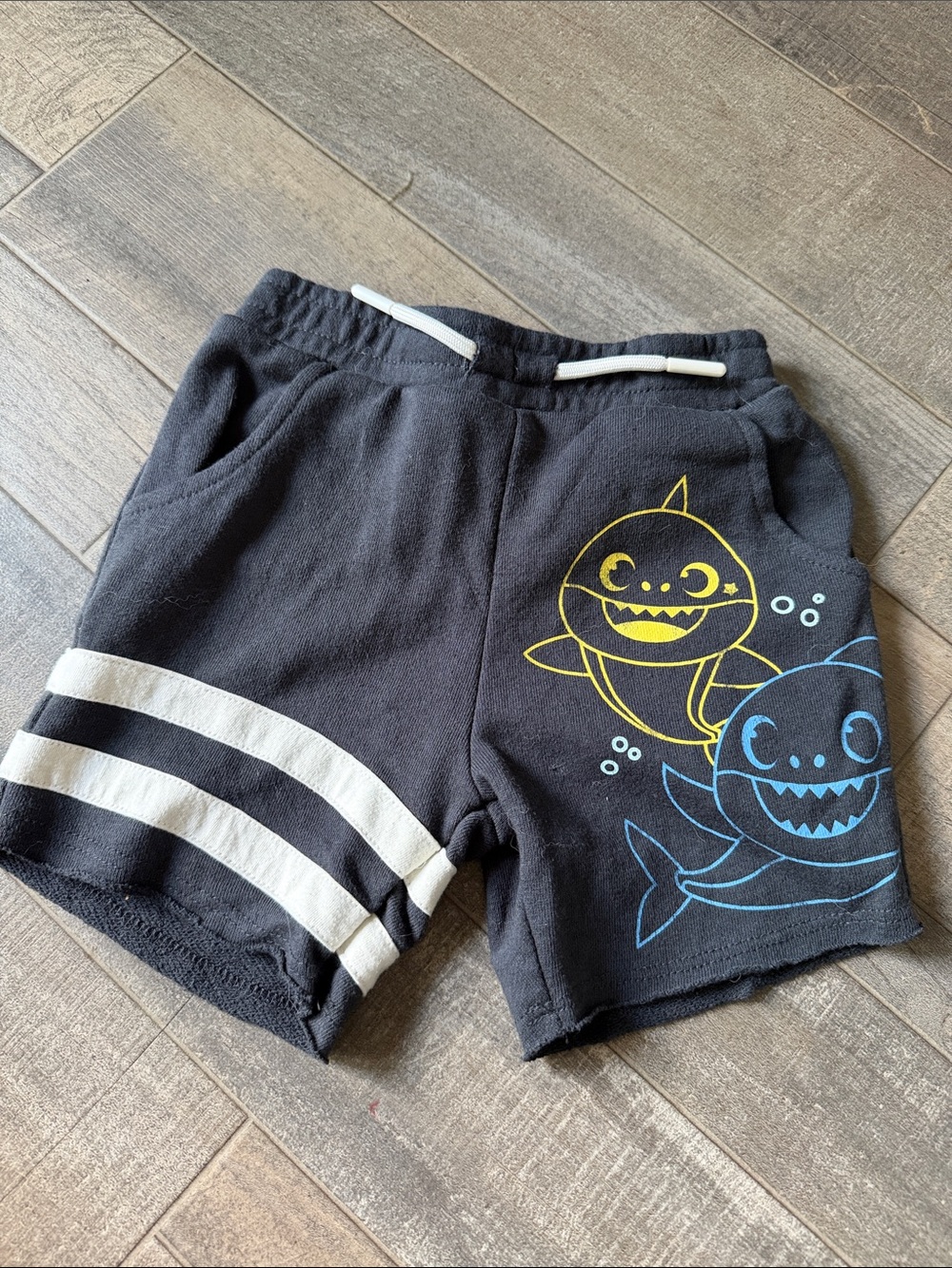 Nickelodeon Black Shorts with Yellow & Blue Shark Graphics